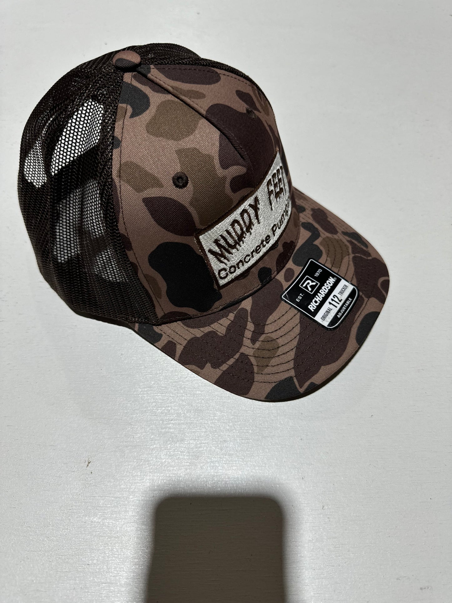 Muddy Feet Concrete Pumping Camo Hat | Richardson 112 Trucker Hat